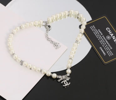 Chanel Romantic Pearl Bow Charm Necklace