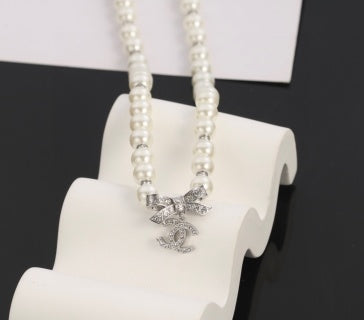 Chanel Romantic Pearl Bow Charm Necklace
