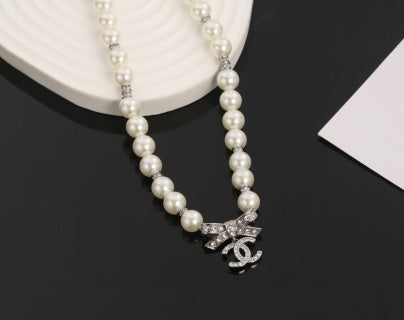 Chanel Romantic Pearl Bow Charm Necklace