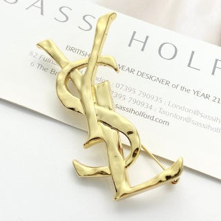 YSL Sculpted Gold Monogram Pin Brooch