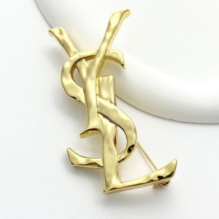 YSL Sculpted Gold Monogram Pin Brooch