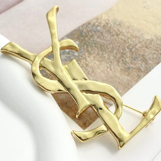 YSL Sculpted Gold Monogram Pin Brooch