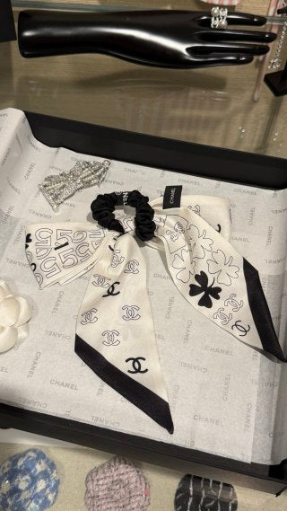 Chanel Double-Sided Bow Hair Tie with Heart and Four-Leaf Clover Motifs