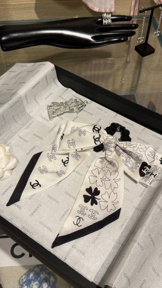 Chanel Double-Sided Bow Hair Tie with Heart and Four-Leaf Clover Motifs