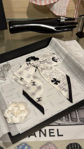 Chanel Double-Sided Bow Hair Tie with Heart and Four-Leaf Clover Motifs