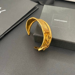YSL Wide Monogram Engraved Gold Cuff Bracelet