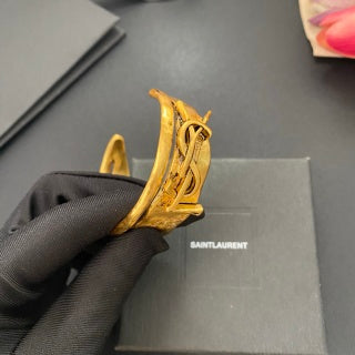 YSL Wide Monogram Engraved Gold Cuff Bracelet
