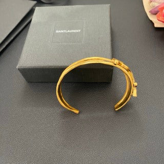 YSL Wide Monogram Engraved Gold Cuff Bracelet