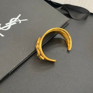 YSL Wide Monogram Engraved Gold Cuff Bracelet