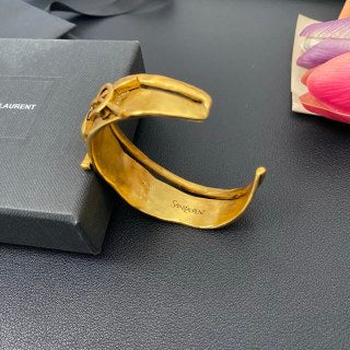YSL Wide Monogram Engraved Gold Cuff Bracelet