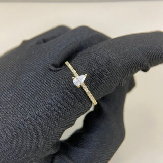 Cartier ring with a pear-shaped diamond center stone and diamond accents