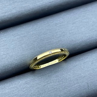 Tiffany narrow ring with a single diamond and square bead-edge detailing