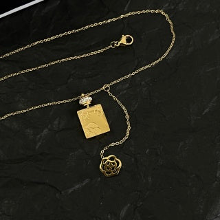 CHANEL Asymmetric Charm Pendant Necklace