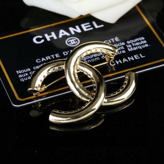 CHANEL Golden Interlock CC Sculptural Brooch