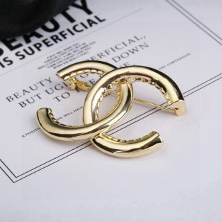 CHANEL Golden Interlock CC Sculptural Brooch