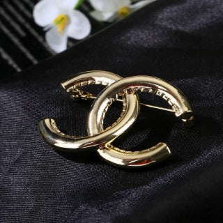 CHANEL Golden Interlock CC Sculptural Brooch