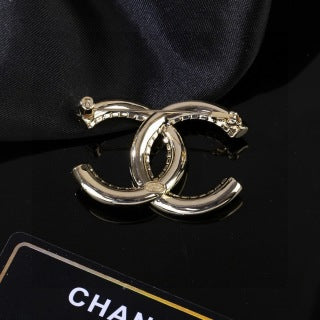 CHANEL Golden Interlock CC Sculptural Brooch