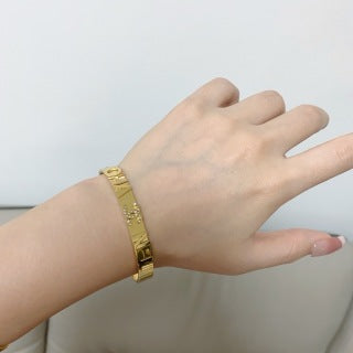CHANEL Celinea Dual-Tone Letter Bangle