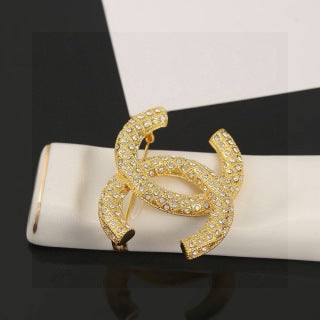 CHANEL Adrienne Radiant Emblem Brooch