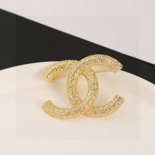 CHANEL Adrienne Radiant Emblem Brooch