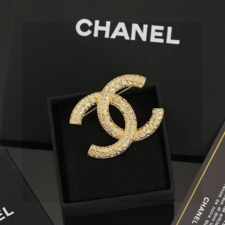 CHANEL Adrienne Radiant Emblem Brooch