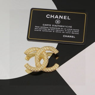 CHANEL Adrienne Radiant Emblem Brooch