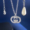 Gucci Interlocking G Crystal Medallion Necklace