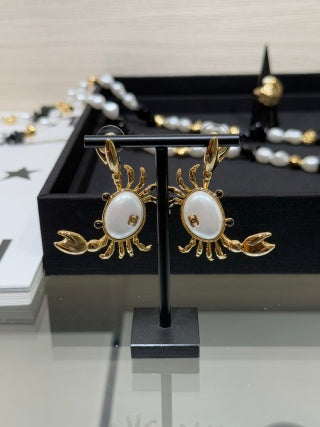 Chanel Gold-Tone Earrings with Crab and Shell Pearl
