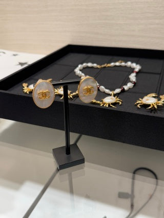 Chanel Vintage Gold-Tone Oval Clip-On Earrings with Natural Mother-of-Pearl