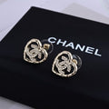 CHANEL Interwoven Heart CC Stud Earrings