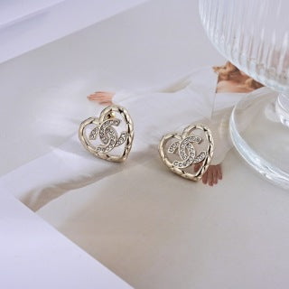 CHANEL Interwoven Heart CC Stud Earrings