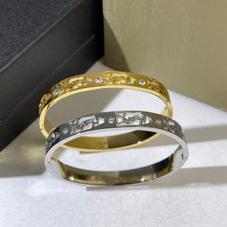 YSL Dual Tone Crystal Emblem Cuff Bracelet
