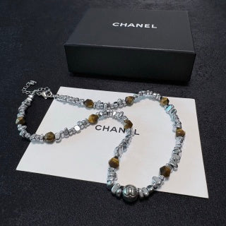 Chunky necklace featuring tiger's eye, silver beads, and crushed silver elements.