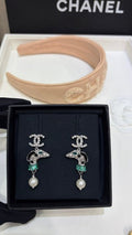 Chanel Silver Pearl Earrings with Dog Motif and Full Pavé Diamonds