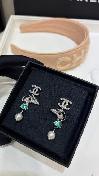 Chanel Silver Pearl Earrings with Dog Motif and Full Pavé Diamonds