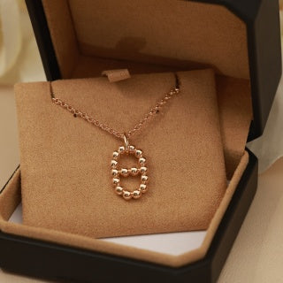 Hermès Beaded Oval Loop Pendant Necklace