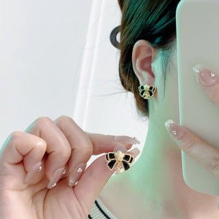 Chanel Camellia black bow stud earrings