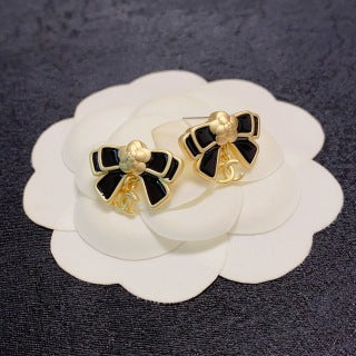 Chanel Camellia black bow stud earrings