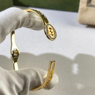 Gucci Interlocking G Round Crystal Medallion Filigree Cuff Bracelet