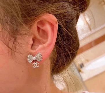 CHANEL Graceful Bow Charm Stud Earrings