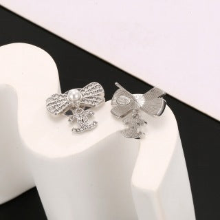 CHANEL Graceful Bow Charm Stud Earrings