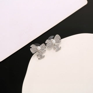 CHANEL Graceful Bow Charm Stud Earrings