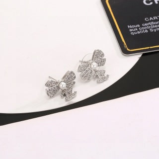 CHANEL Graceful Bow Charm Stud Earrings