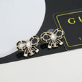 Chanel Crystal Bow Charm Earrings – Elegant Luxury Fashion Jewelry