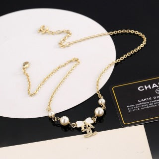 Chanel Pearl Bow Charm Necklace