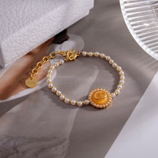 Dior Liora Pearl CD Medallion Charm Bracelet