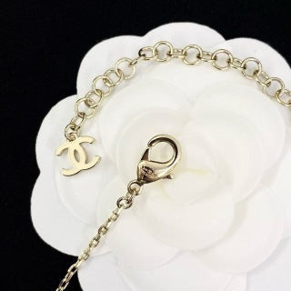 Chanel Elegant Pearl Bow Charm Necklace