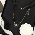 Chanel Elegant Pearl Bow Charm Necklace