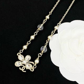 Chanel Elegant Pearl Bow Charm Necklace