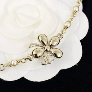 Chanel Elegant Pearl Bow Charm Necklace